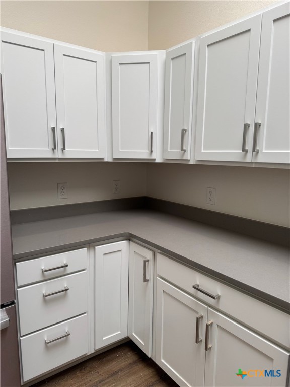 11 South Main Street, Unit 106 Temple, TX 76501 - Photo 4 of 13 a view of an empty kitchen and cabinets