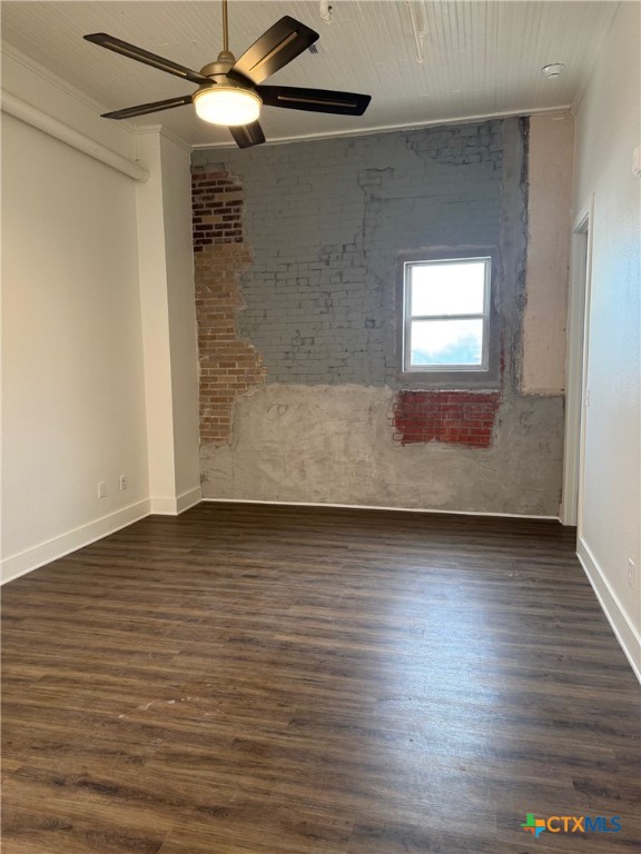 11 South Main Street, Unit 106 Temple, TX 76501 - Photo 6 of 13 a view of a room with wooden floor and a ceiling fan