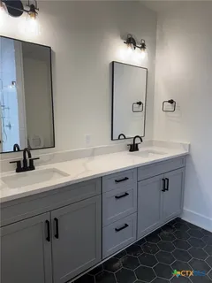 a bathroom with a toilet and a sink