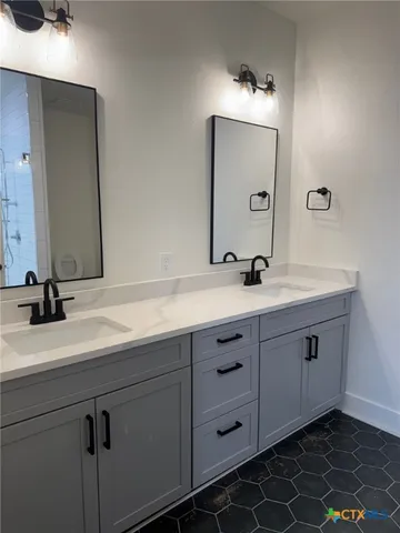 a bathroom with a toilet and a sink