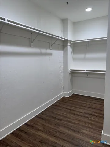 a view of cabinets and wooden floor