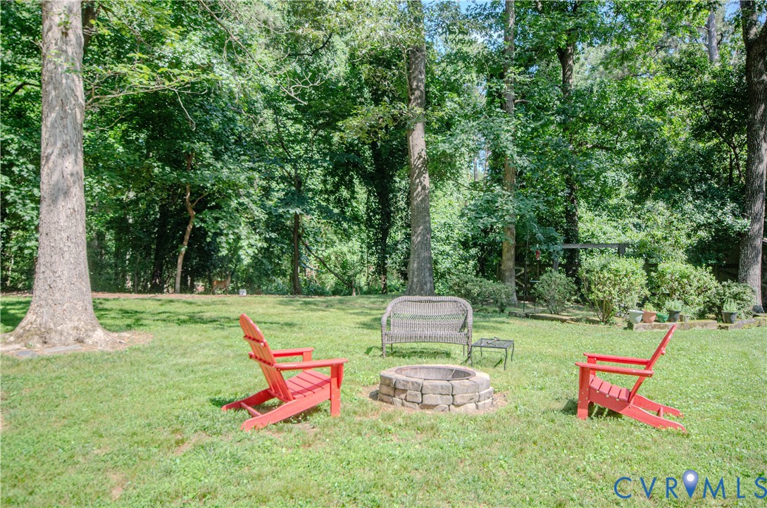 12500 Musical Lane Midlothian, VA 23113 - Photo 48 of 51 Expansive green lawn with a built-in stone fire pi