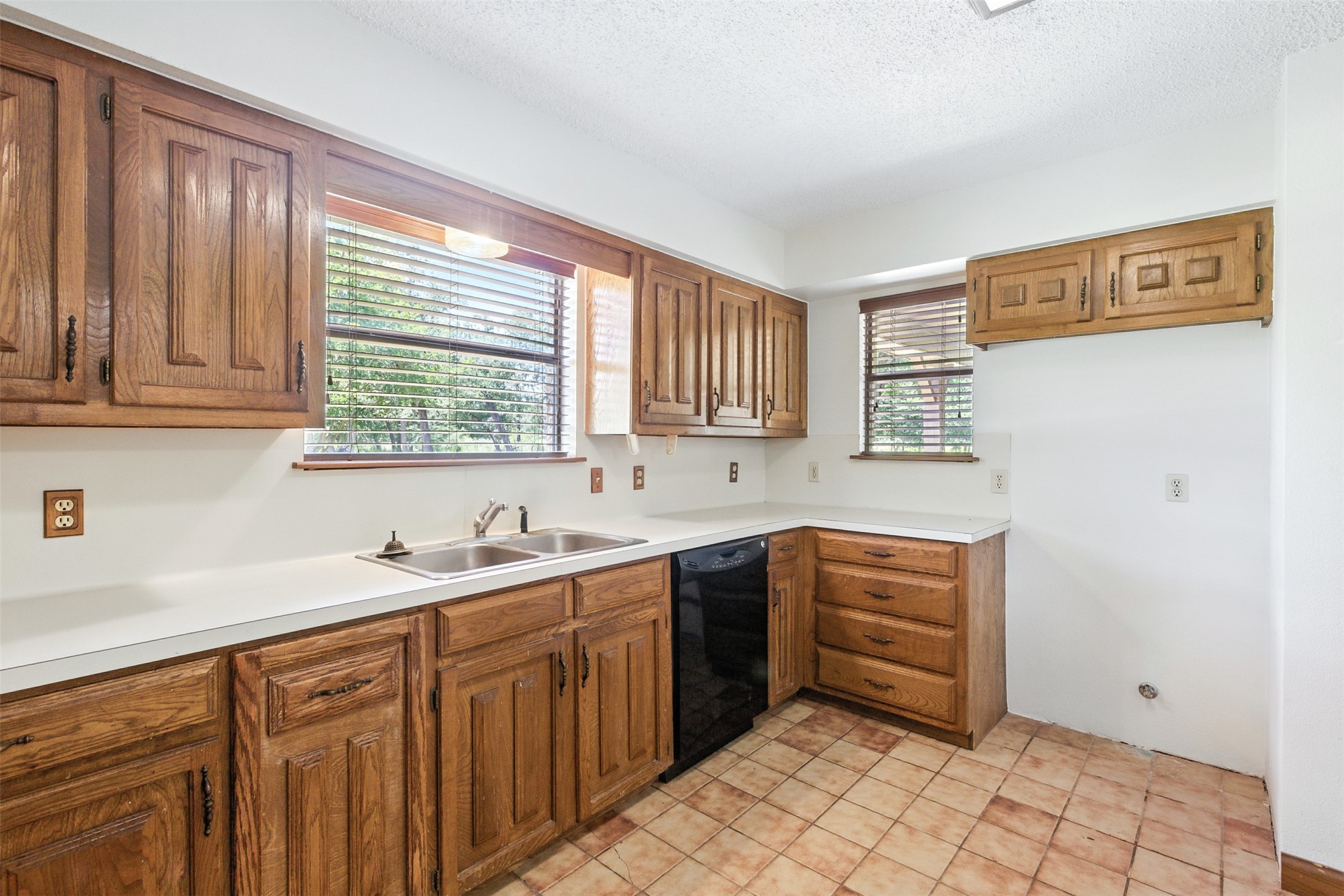 1680 Bowler Road Waller, TX 77484 - Photo 16 of 42 a kitchen with stainless steel appliances granite countertop a sink and a window
