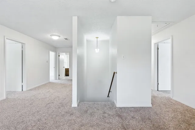 a view of a room with a hallway