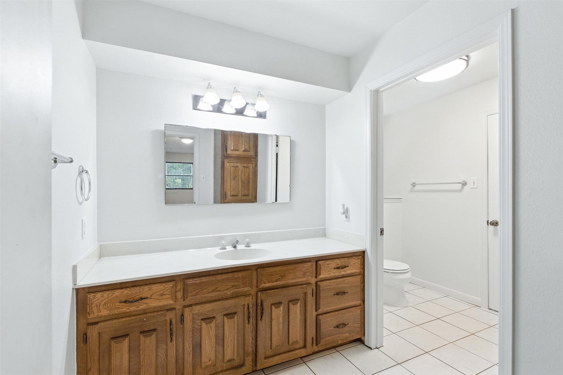 1680 Bowler Road Waller, TX 77484 - Photo 30 of 42 a spacious bathroom with a double vanity sink mirror and double