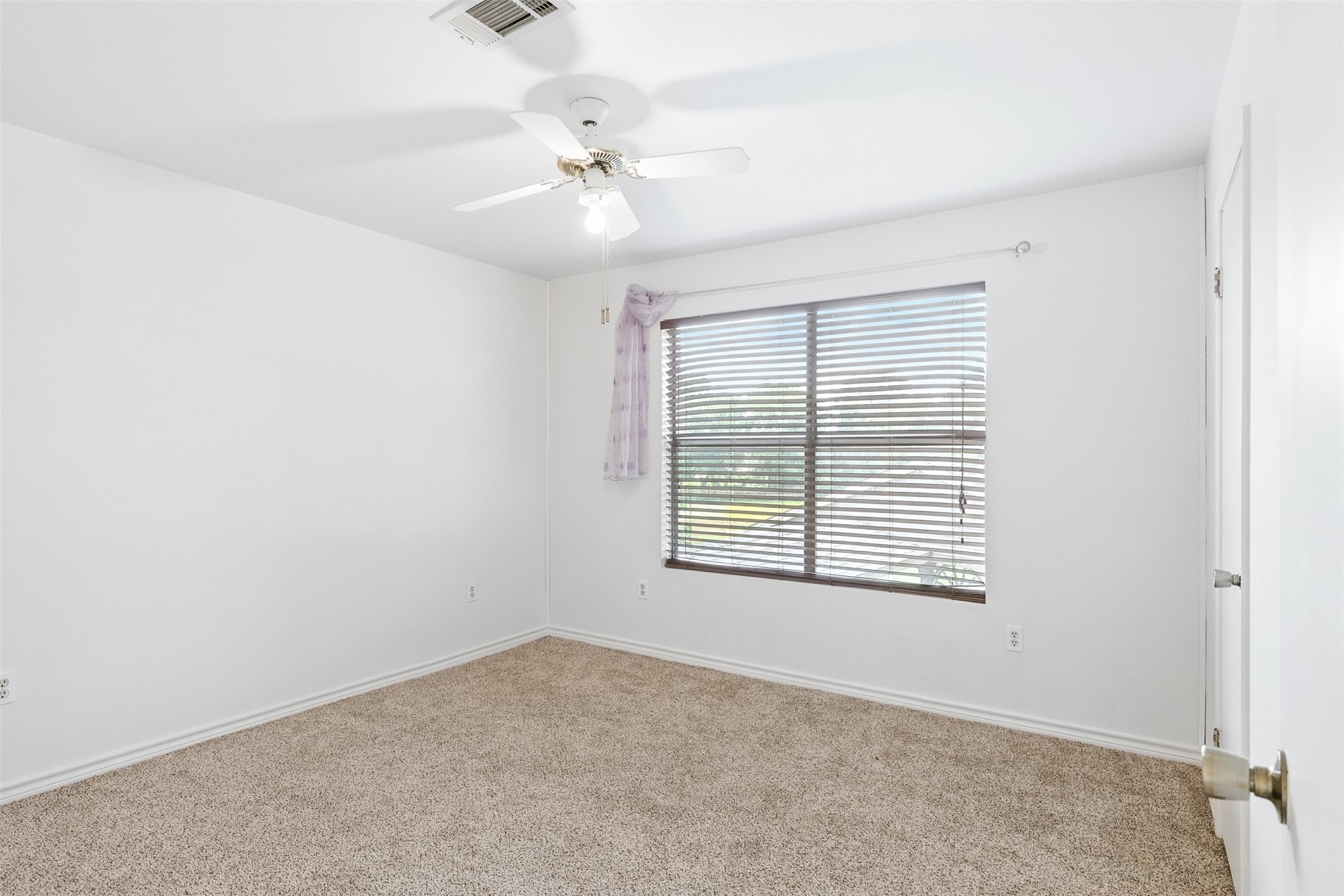 1680 Bowler Road Waller, TX 77484 - Photo 32 of 42 a view of an empty room with a window
