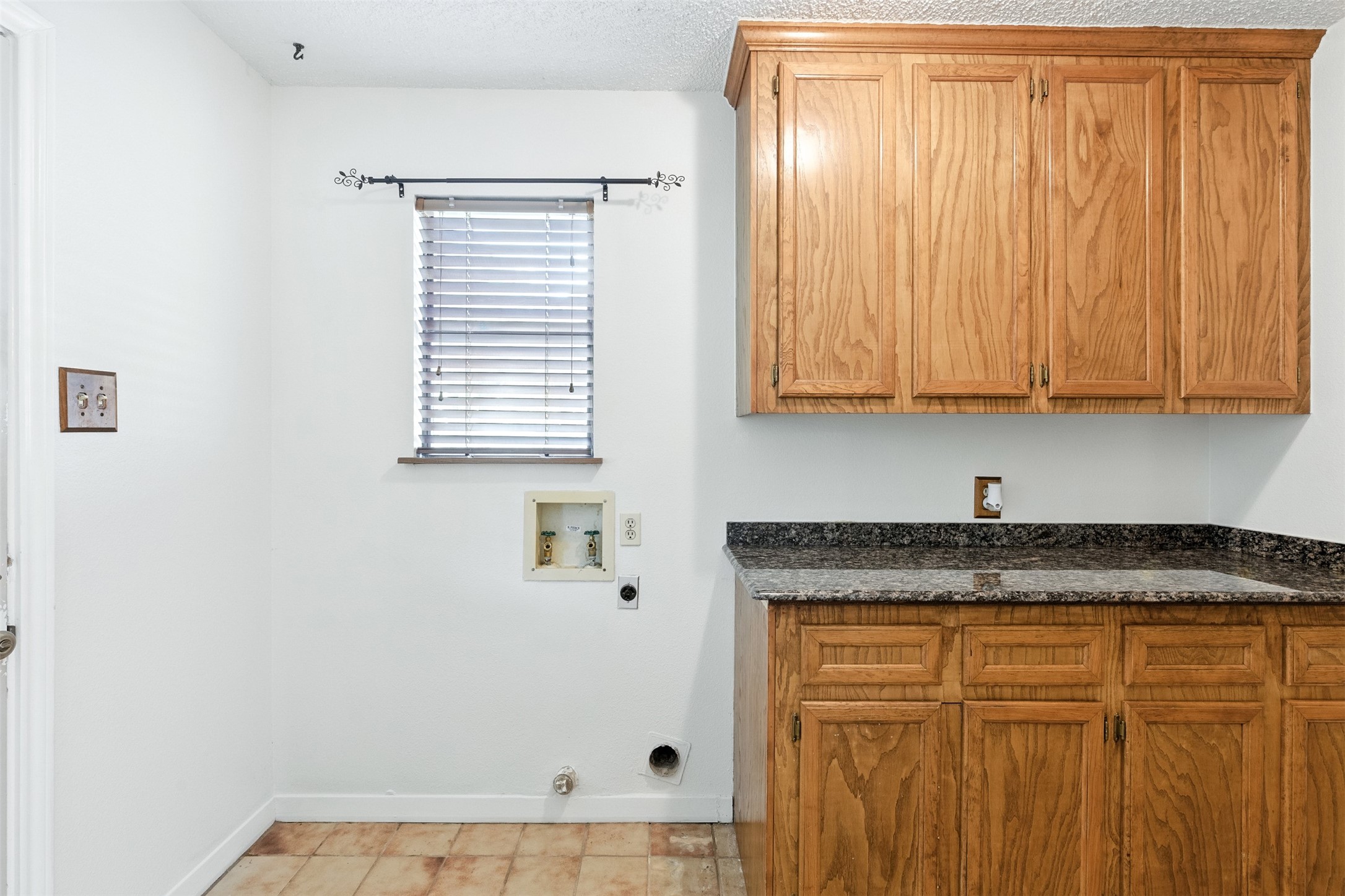 1680 Bowler Road Waller, TX 77484 - Photo 34 of 42 a bathroom with a granite countertop sink and cabinets