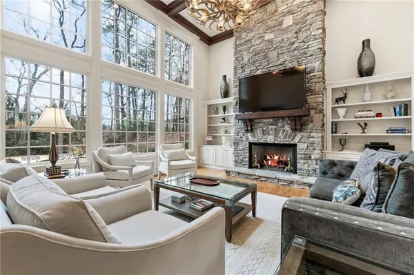 a living room with furniture and a fireplace