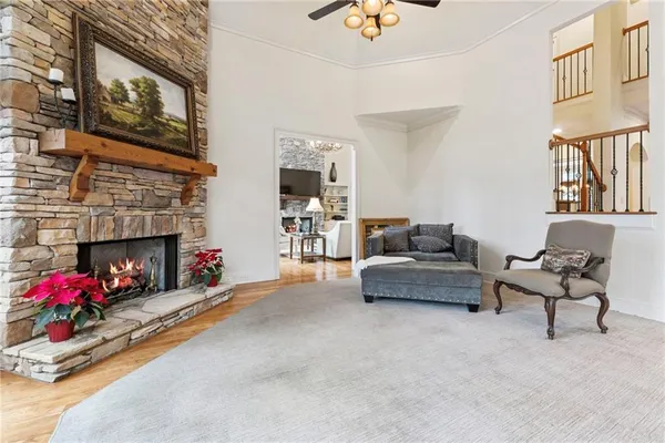 a living room with furniture fireplace and flat screen tv