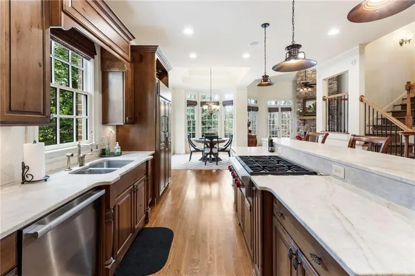 a kitchen with white cabinets and a sink