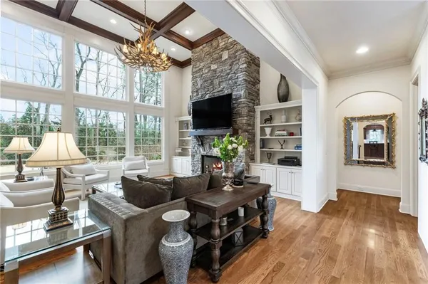 a living room with furniture and a large window