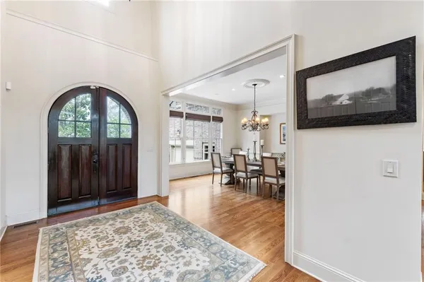 a view of a hallway with furniture and window