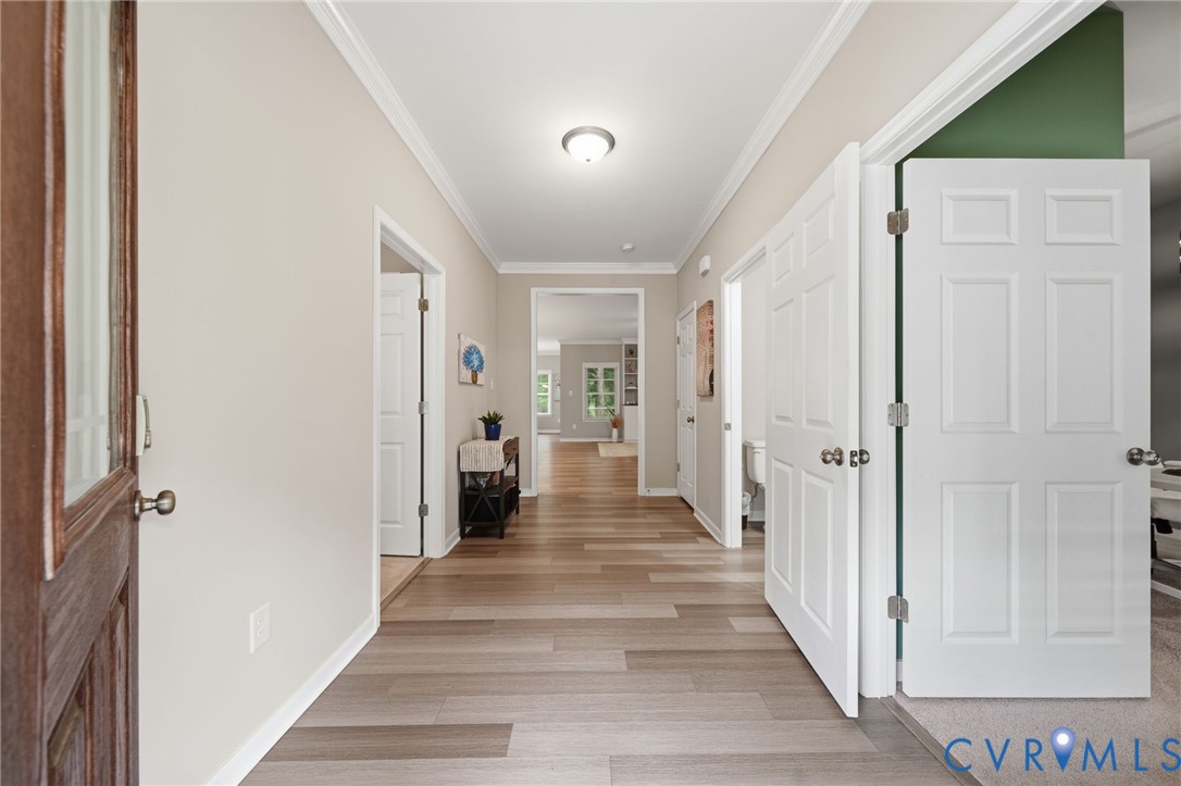 7598 Rural Point Road Mechanicsville, VA 23116 - Photo 4 of 41 a view of a hallway with wooden floor and closet
