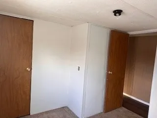 a view of hallway with closet area