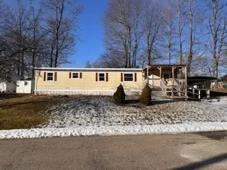 a front view of a house with yard