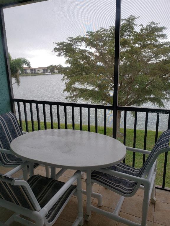 25225 Rampart Boulevard, Unit 1908 Punta Gorda, FL 33983 - Photo 13 of 15 a view of a balcony with chairs