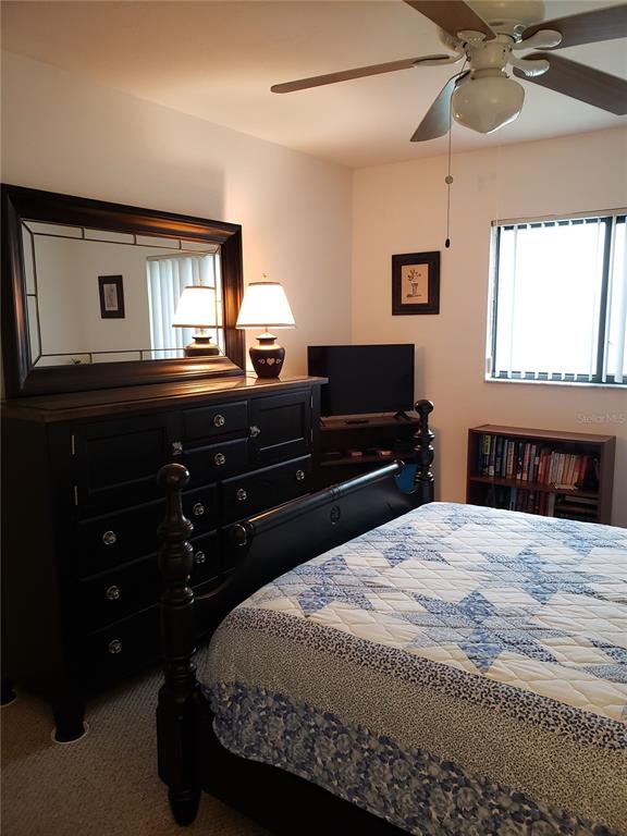 25225 Rampart Boulevard, Unit 1908 Punta Gorda, FL 33983 - Photo 9 of 15 a bedroom with a bed and a window