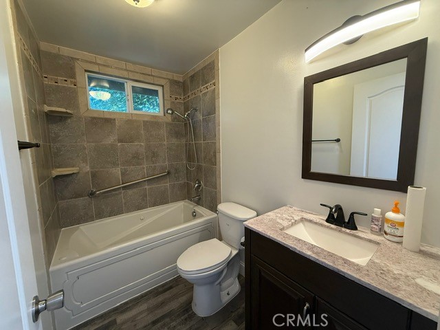 2911 Rancho Vista Drive Lucerne, CA 95458 - Photo 15 of 17 a bathroom with a granite countertop toilet sink and mirror