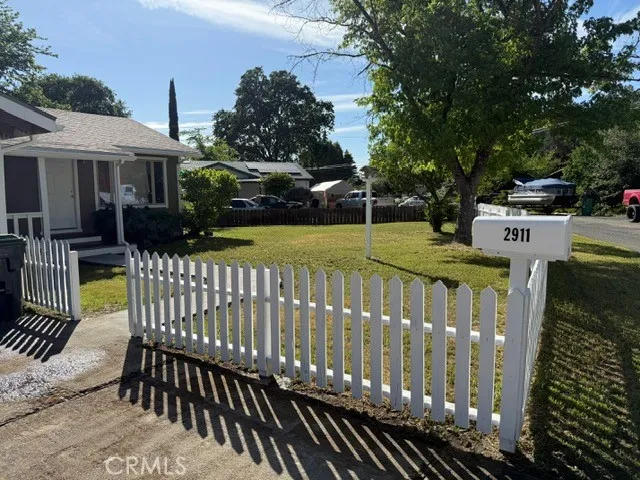 a view of a wooden deck with chairs