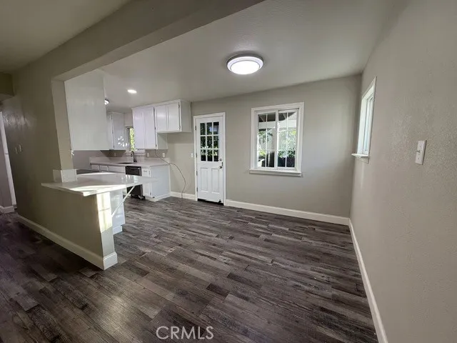 a view of kitchen and wooden floor