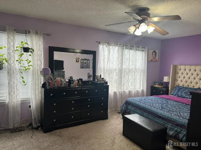 a bed room with a bed and a mirror