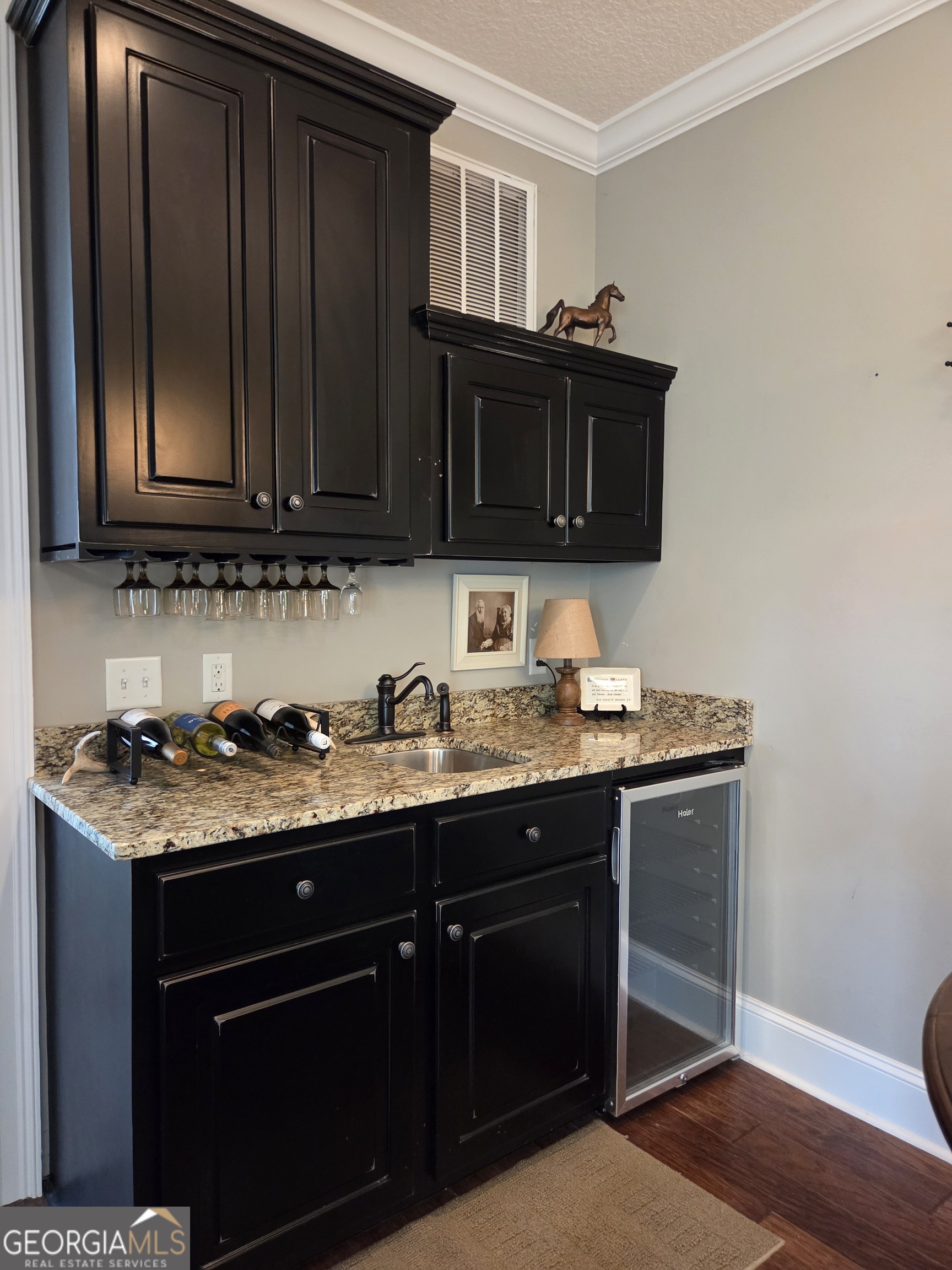 300 Hammond Powell Road Hazlehurst, GA 31539 - Photo 72 of 91 a kitchen with granite countertop a sink and a stove