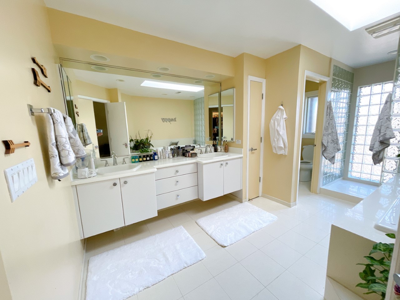 2047 Sheridan Road Buffalo Grove, IL 60089 - Photo 15 of 25 a large bathroom with a large mirror vanity and sink
