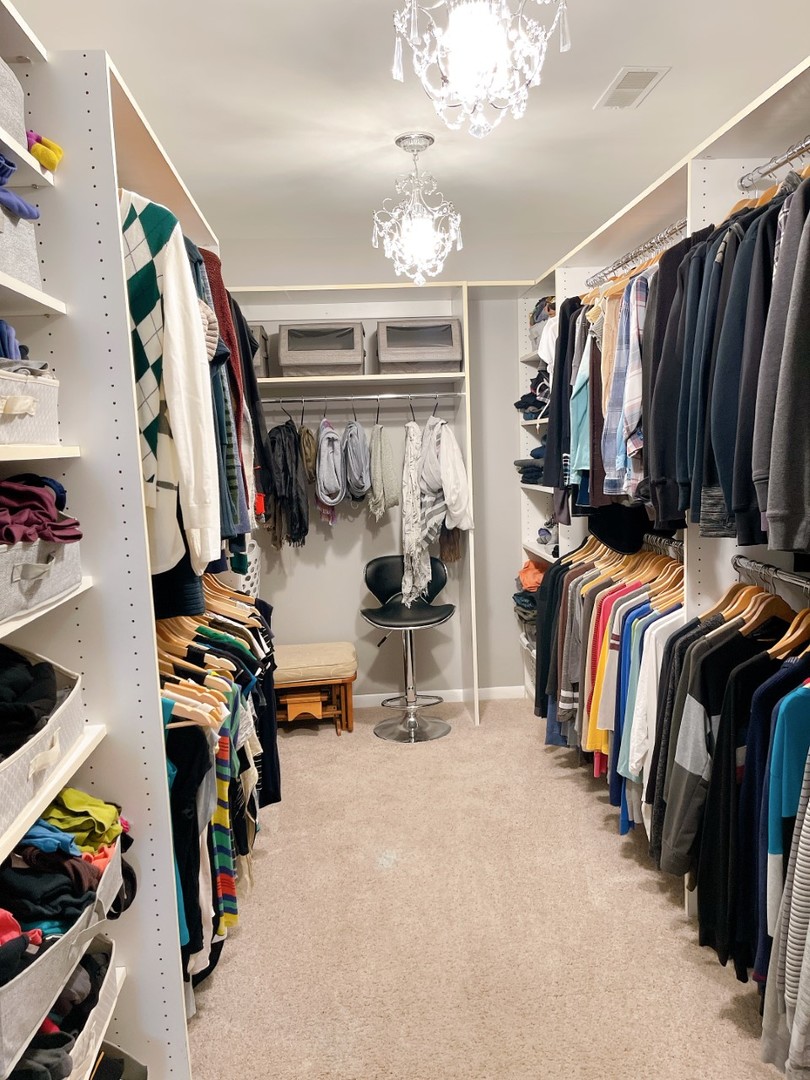 2047 Sheridan Road Buffalo Grove, IL 60089 - Photo 16 of 25 a view of walk in closet with clothes and shoes