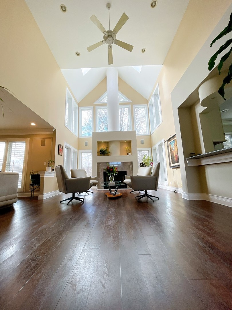 2047 Sheridan Road Buffalo Grove, IL 60089 - Photo 10 of 25 a living room with furniture a window and a wooden floor