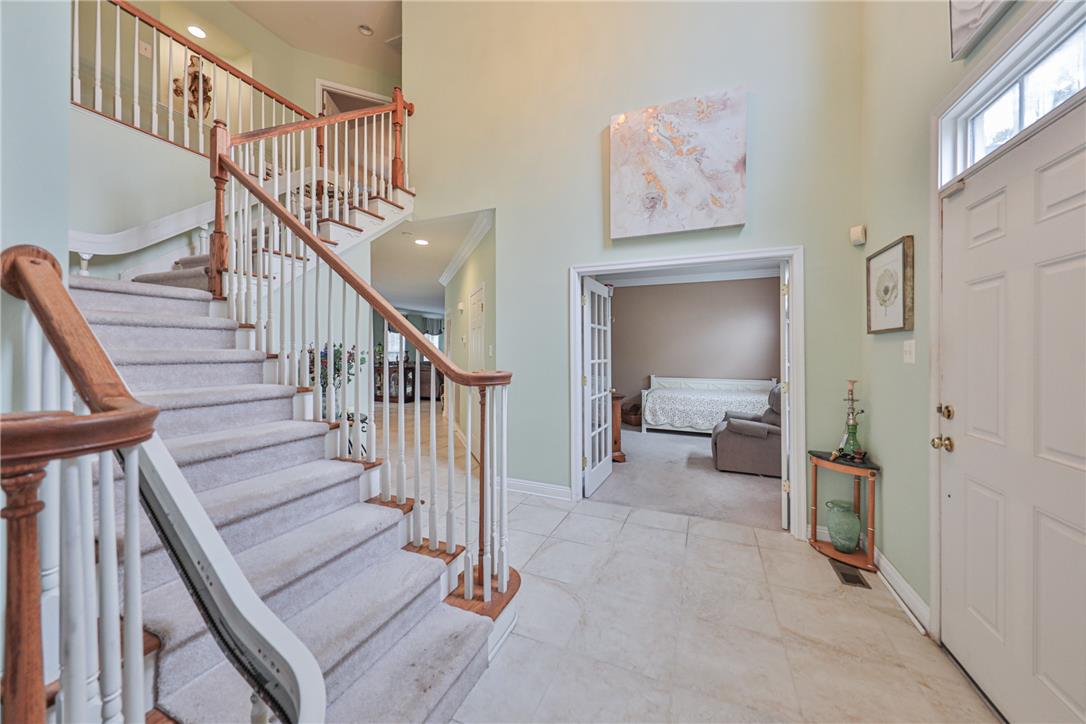 138 Clover Hollow Road Easton, PA 18045 - Photo 11 of 95 A grand entrance welcomes you with a sweeping staircase and French doors.