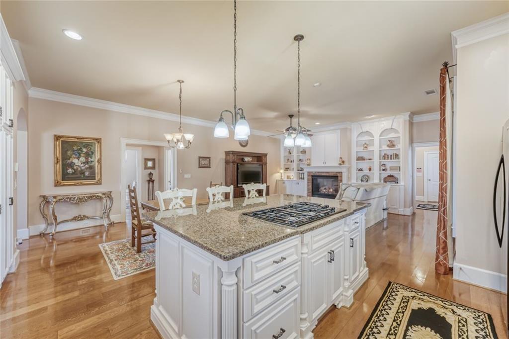 2380 Muskogee Lane Braselton, GA 30517 - Photo 13 of 30 a view of living room kitchen island dining table and microwave