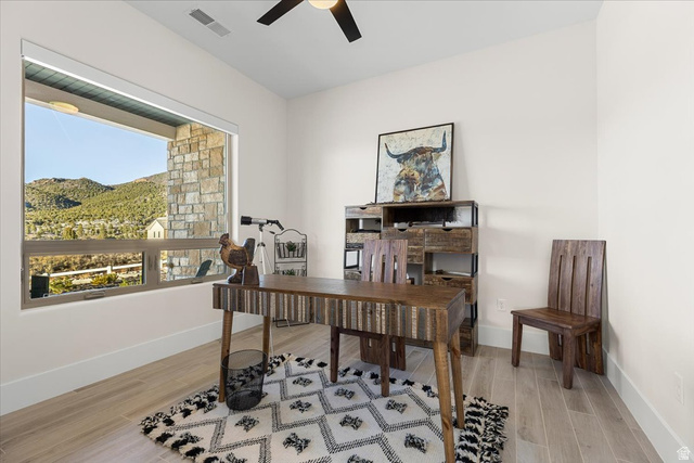 1210 East Bristle Cone Road Pine Valley, UT 84781 - Photo 6 of 54 Office with light wood-like tile flooring, a ceiling fan, and a mountain view