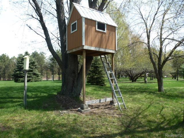 2727 Bowen Road Howell, MI 48843 - Photo 31 of 34 Carpeted Playhouse with Metal Roof .... What Fun for the Kids!