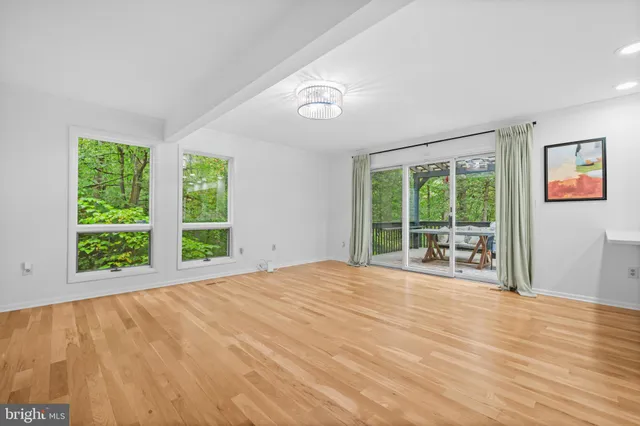 a bathroom with a toilet a sink and a mirror
