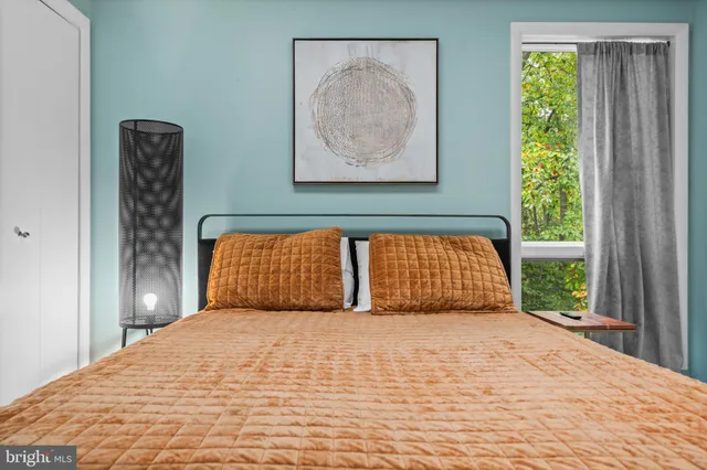 an empty room with chandelier fan