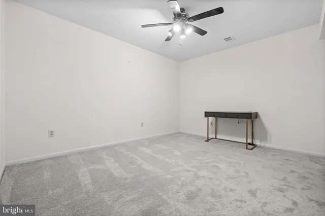 a view of a patio with a table chairs and a backyard