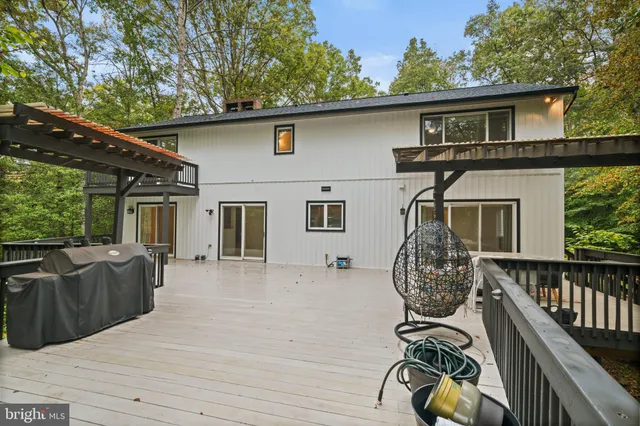 a view of a livingroom with furniture and a window