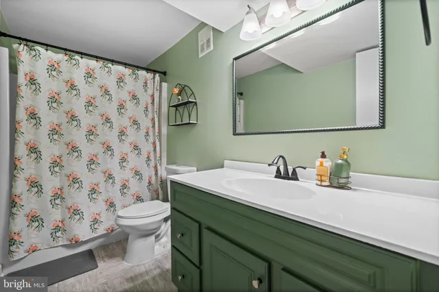 a living room with fireplace furniture and a flat screen tv