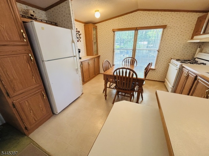 35 Roberts Road Toms River, NJ 08755 - Photo 7 of 17 a dining room with furniture a rug wooden floor and a rug