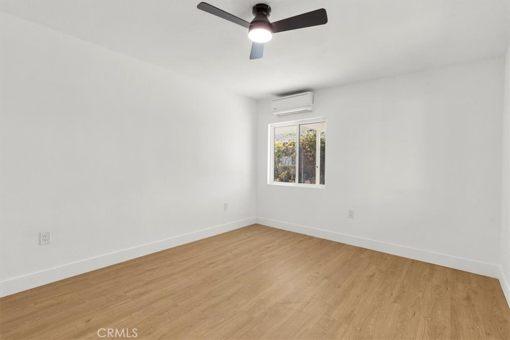 6431 Goleta Avenue Yucca Valley, CA 92284 - Photo 16 of 23 an empty room with a window and a ceiling fan