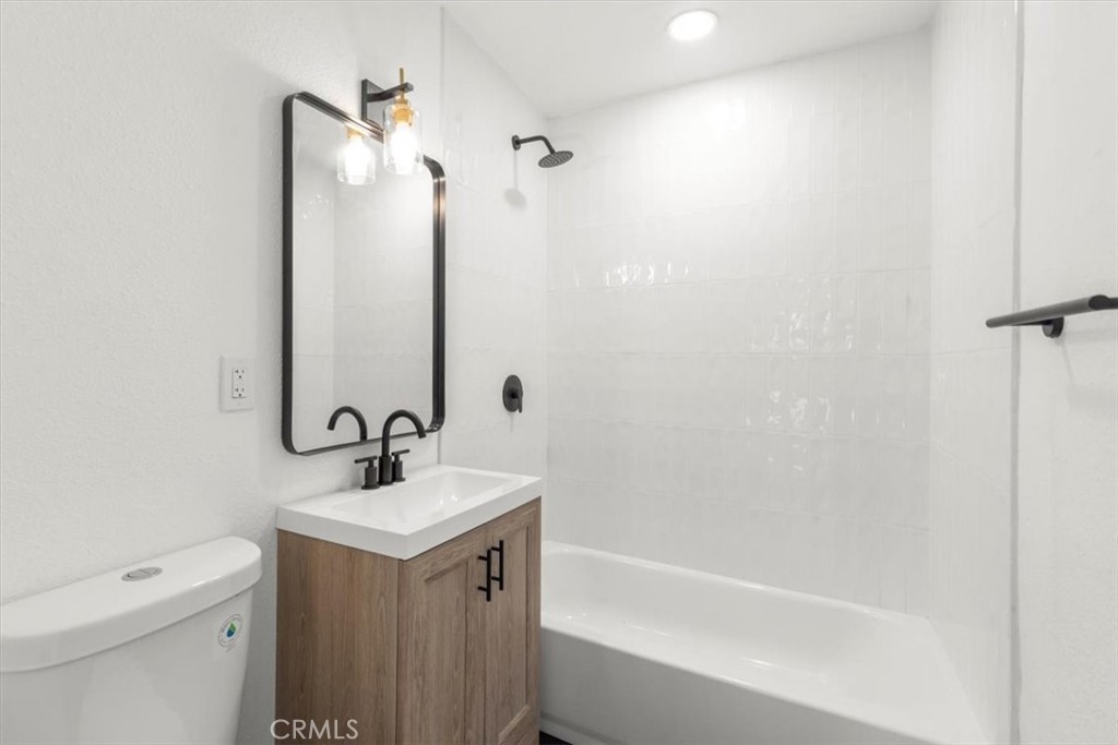 6431 Goleta Avenue Yucca Valley, CA 92284 - Photo 18 of 23 a bathroom with a sink a toilet and shower