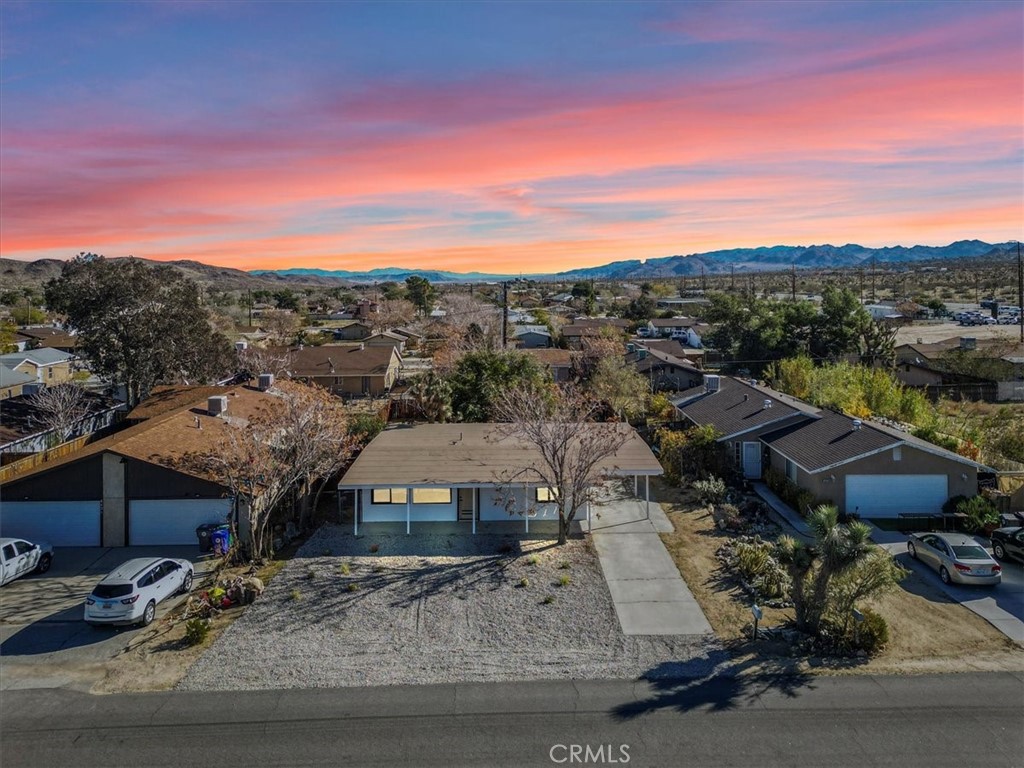 6431 Goleta Avenue Yucca Valley, CA 92284 - Photo 22 of 23 a view of a houses with a terrace