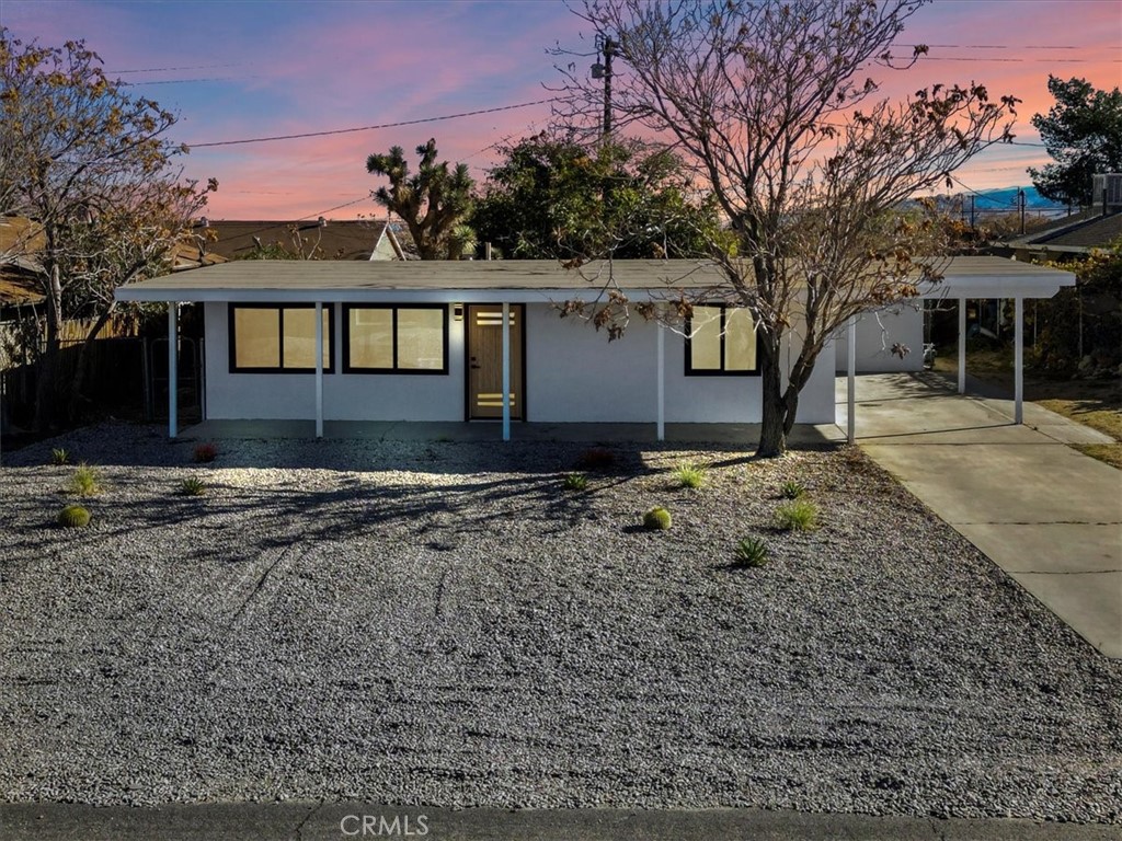 6431 Goleta Avenue Yucca Valley, CA 92284 - Photo 23 of 23 a front view of a house with a yard