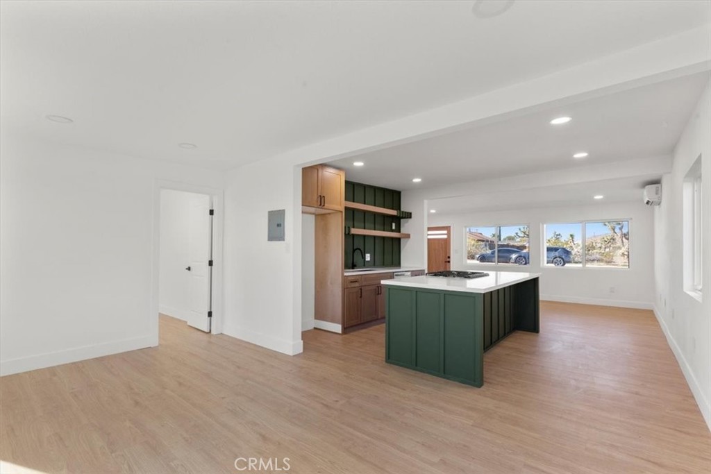6431 Goleta Avenue Yucca Valley, CA 92284 - Photo 7 of 23 a kitchen with stainless steel appliances a refrigerator and a wooden cabinets