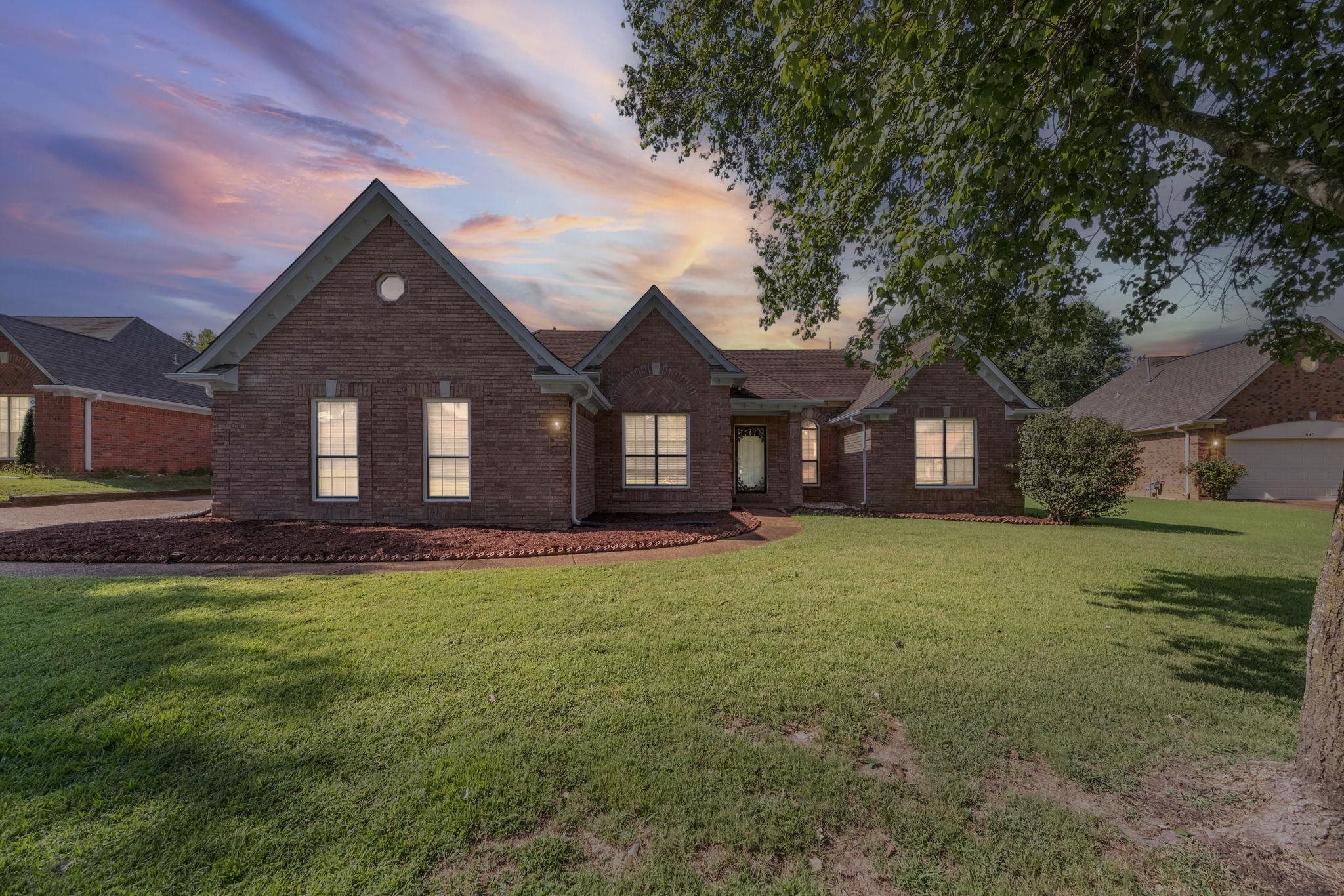 8409 Ridge Fall Cove Memphis, TN 38018 - Photo 3 of 28 View of front facade with brick siding and a lawn