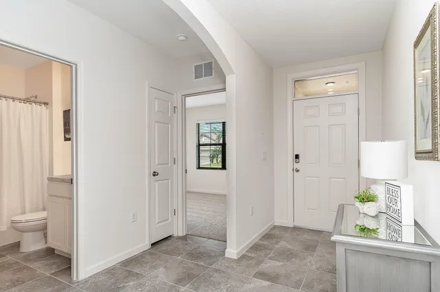 a view of an entryway with wooden floor