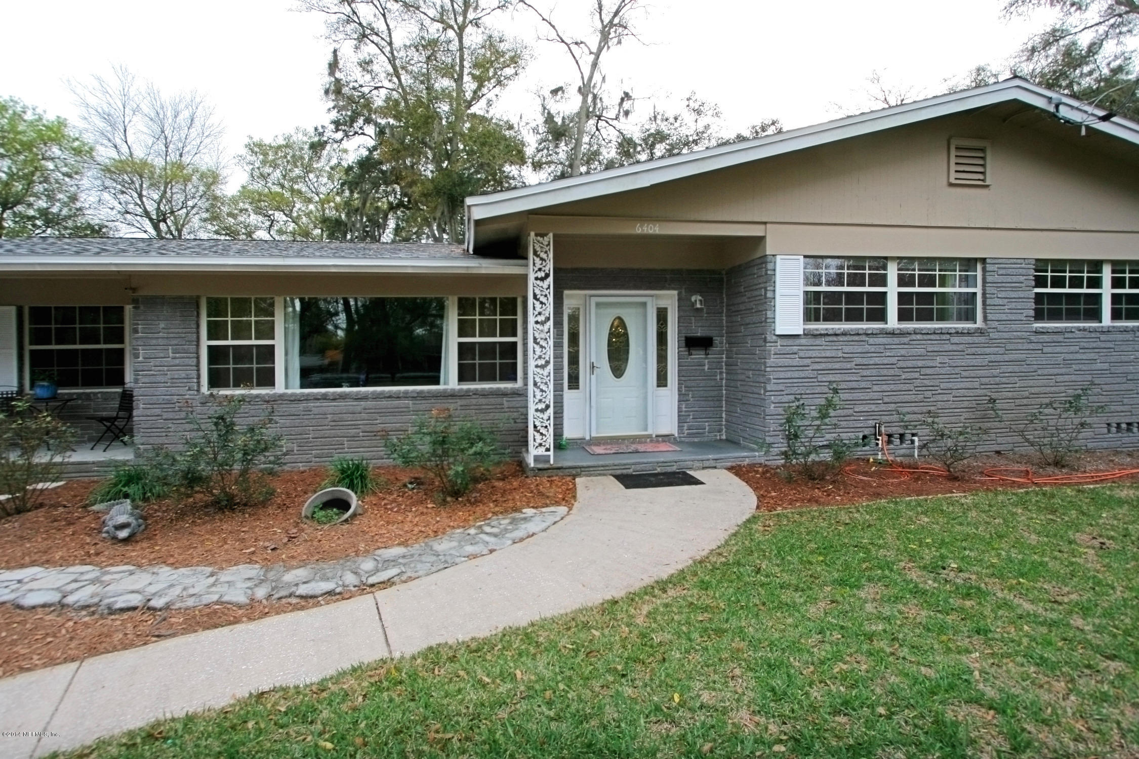 6404 Heidi Road Jacksonville, FL 32277 - Photo 1 of 26 front view of a house with a yard