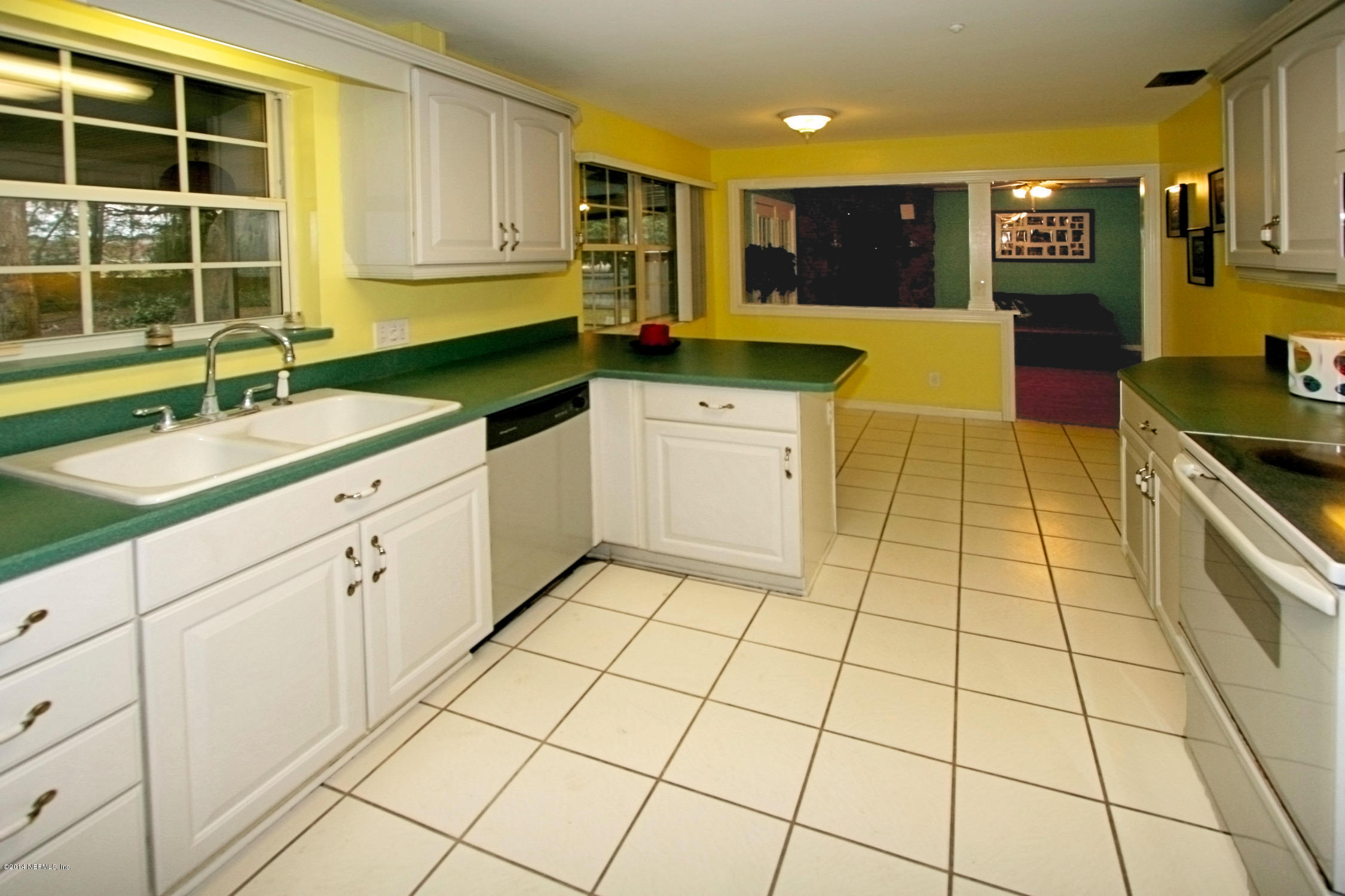 6404 Heidi Road Jacksonville, FL 32277 - Photo 13 of 26 a kitchen with stainless steel appliances a sink and cabinets