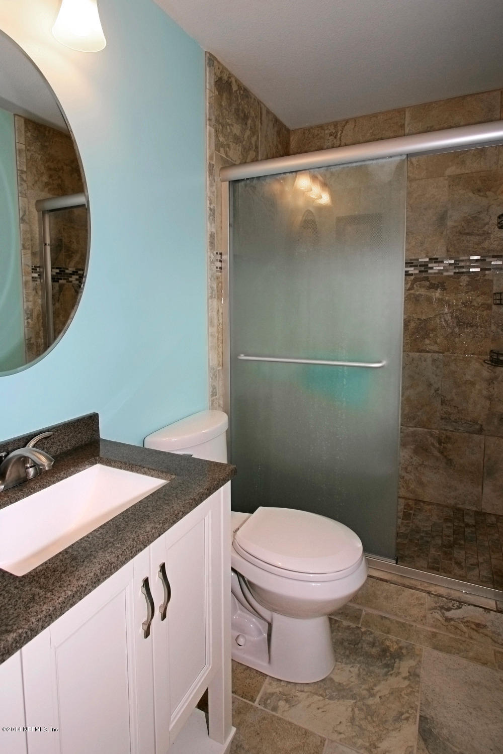 6404 Heidi Road Jacksonville, FL 32277 - Photo 18 of 26 a bathroom with a granite countertop sink mirror vanity and toilet