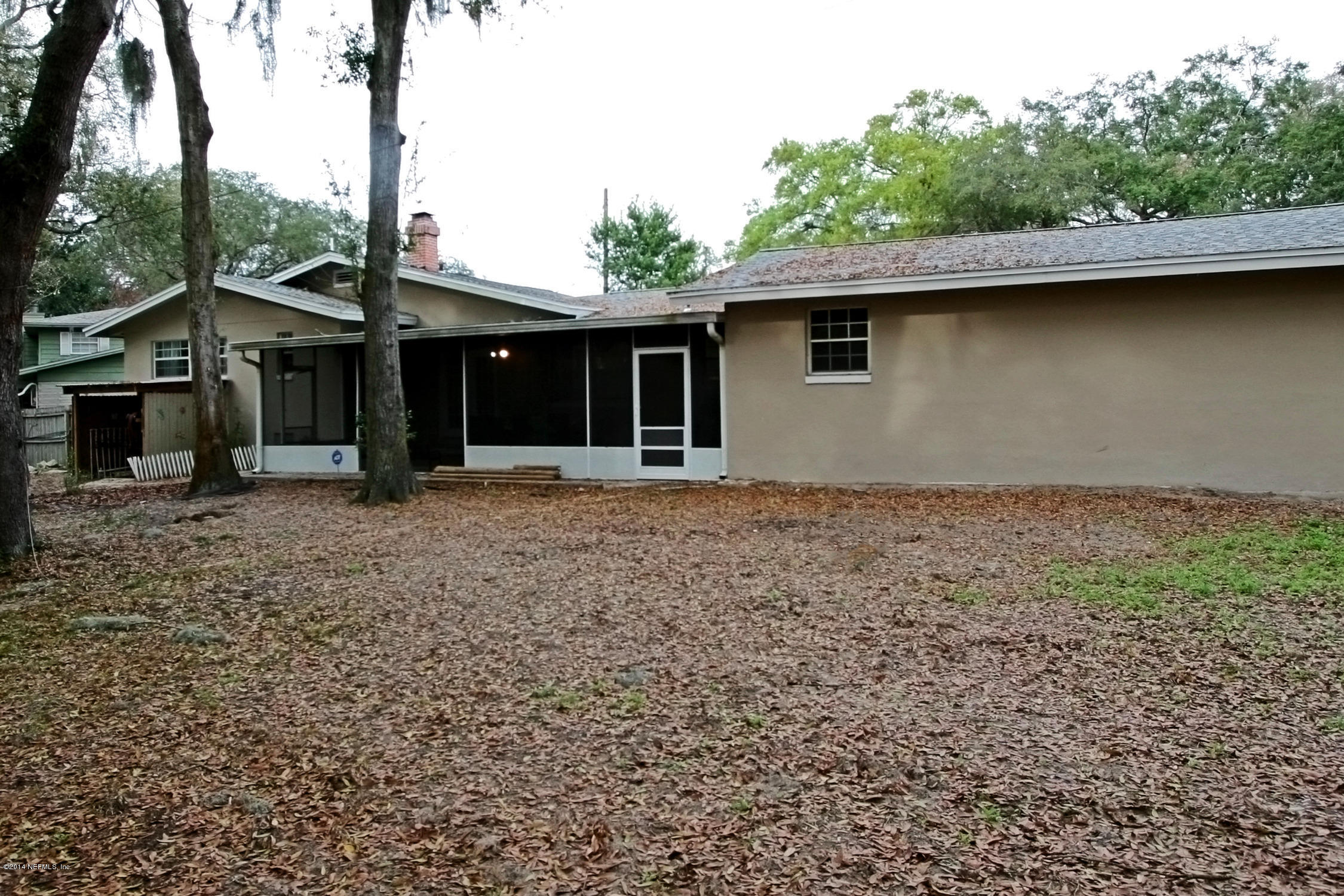 6404 Heidi Road Jacksonville, FL 32277 - Photo 24 of 26 a backyard of a house with lots of green space